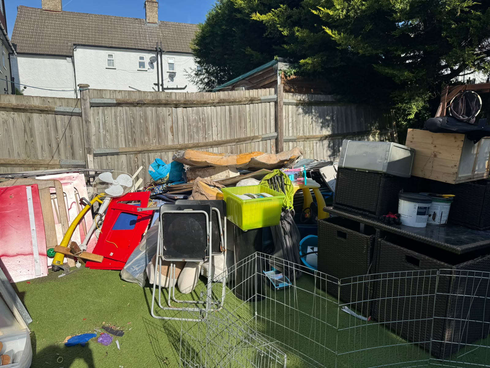 Cluttered backyard before household waste clearance