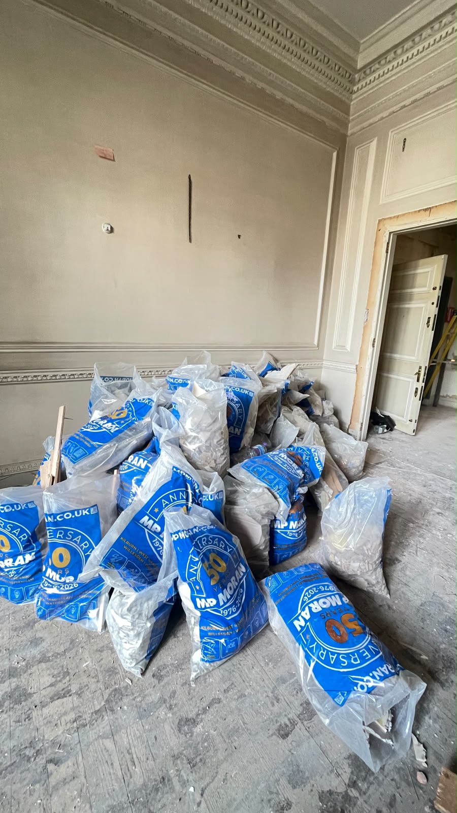 Room filled with waste bags before household clearance