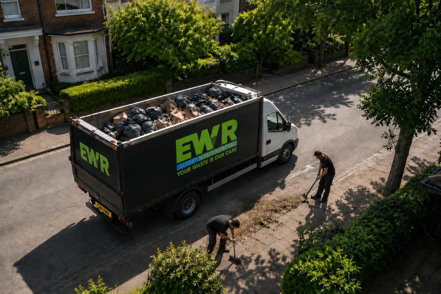 EWR waste removal truck on a London residential street with team clearing waste