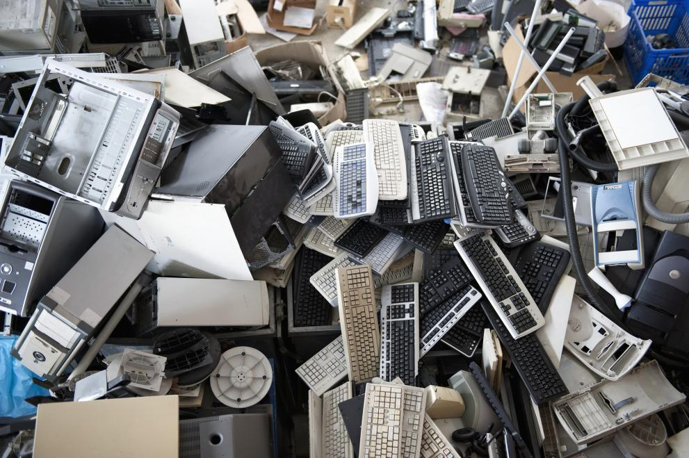 Pile of old computer keyboards and electronic waste