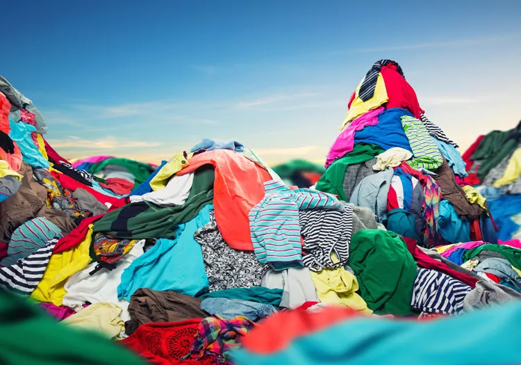 Large heap of discarded textiles and clothing