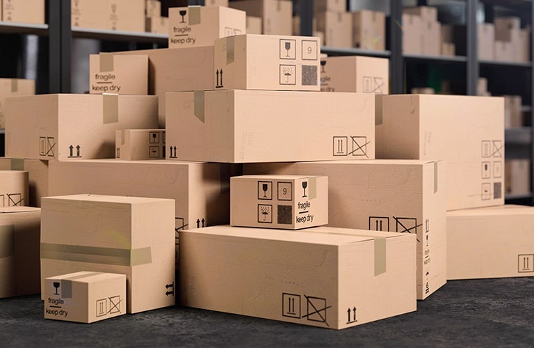 Large stack of cardboard boxes and industrial packaging waste