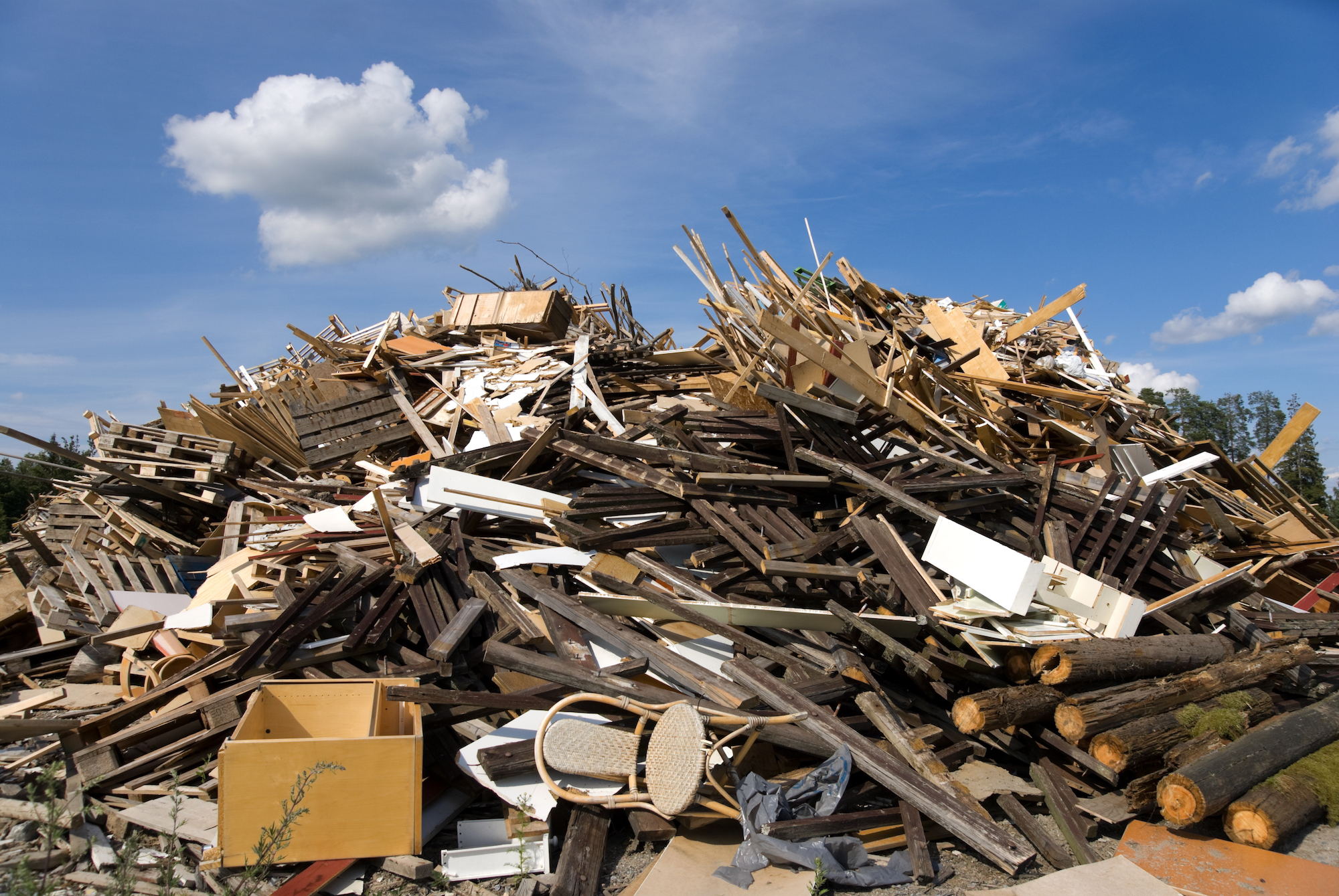 Pile of discarded wooden planks and timber waste