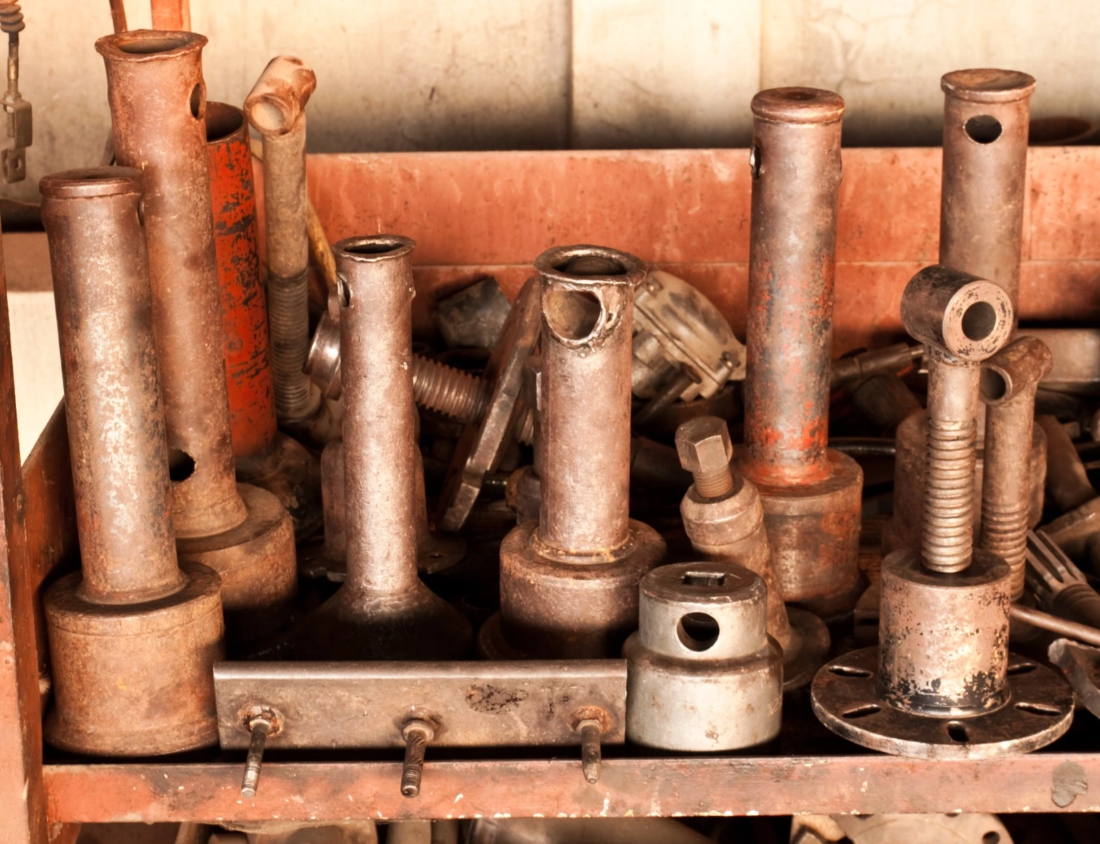 Old metal pipes and plumbing fittings awaiting disposal
