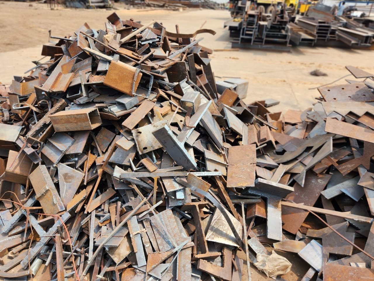 Pile of rusted scrap metal pipes and beams