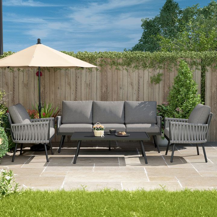 Outdoor patio furniture including a sofa and table