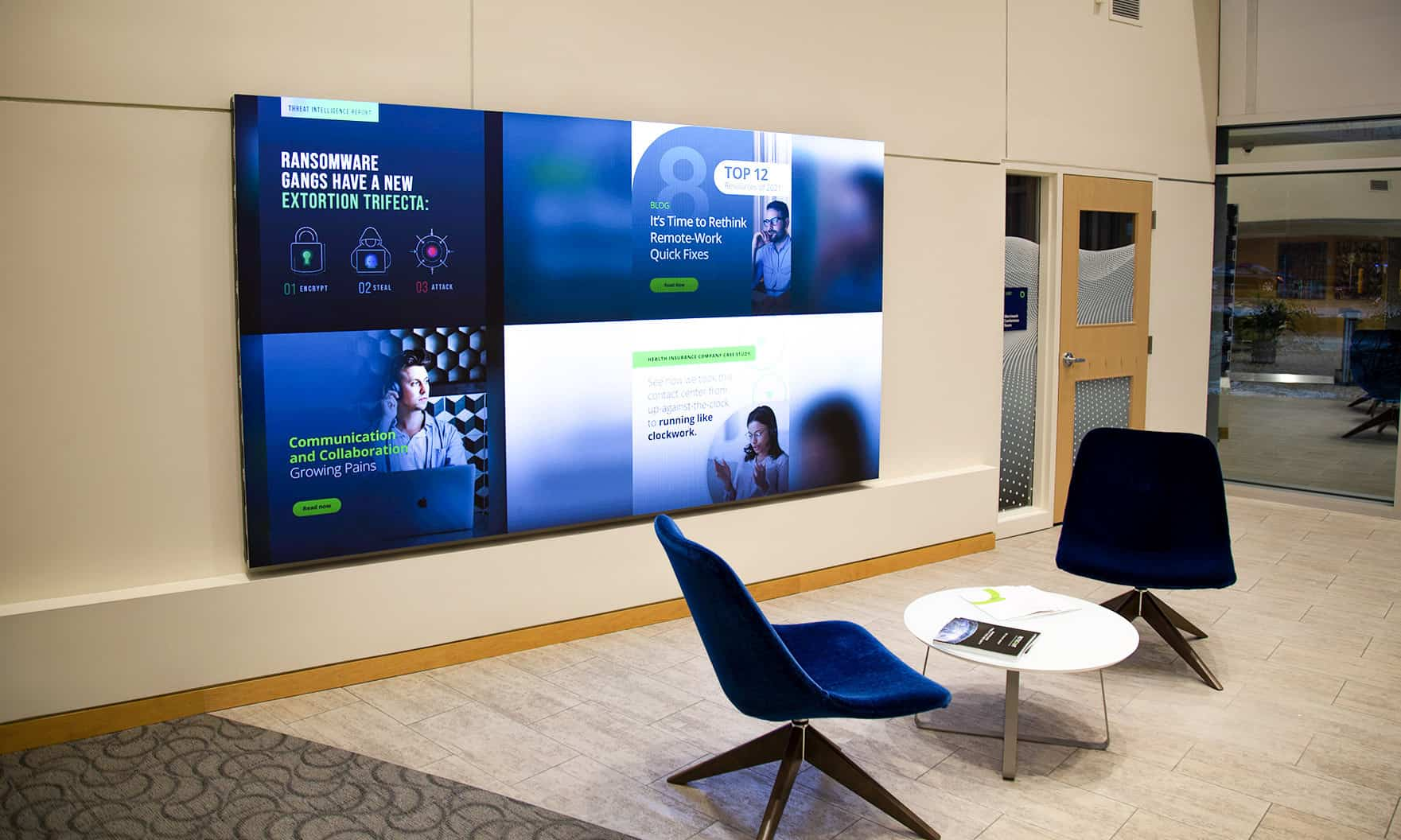 Large digital display screen on an office wall