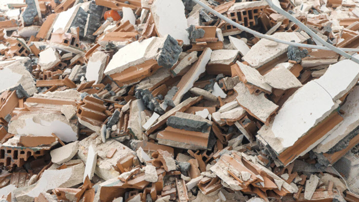 Pile of office and commercial waste including bricks and construction debris