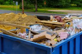 Skip filled with renovation waste including wood and plasterboard